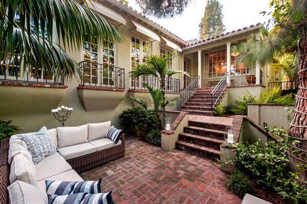 Stairs lead down to an outdoor sunken living room at the back of Jodie Foster's house.