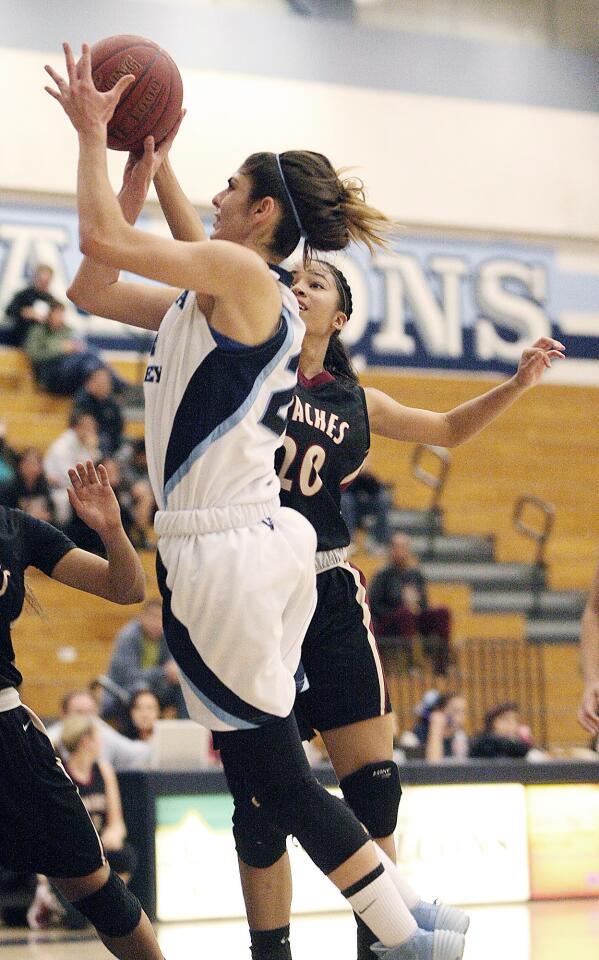 CV's Ella Stepanian goes up for shot attempt past Arcadia's Rachel Chavous during a game at CV High on Friday, January 24, 2014.