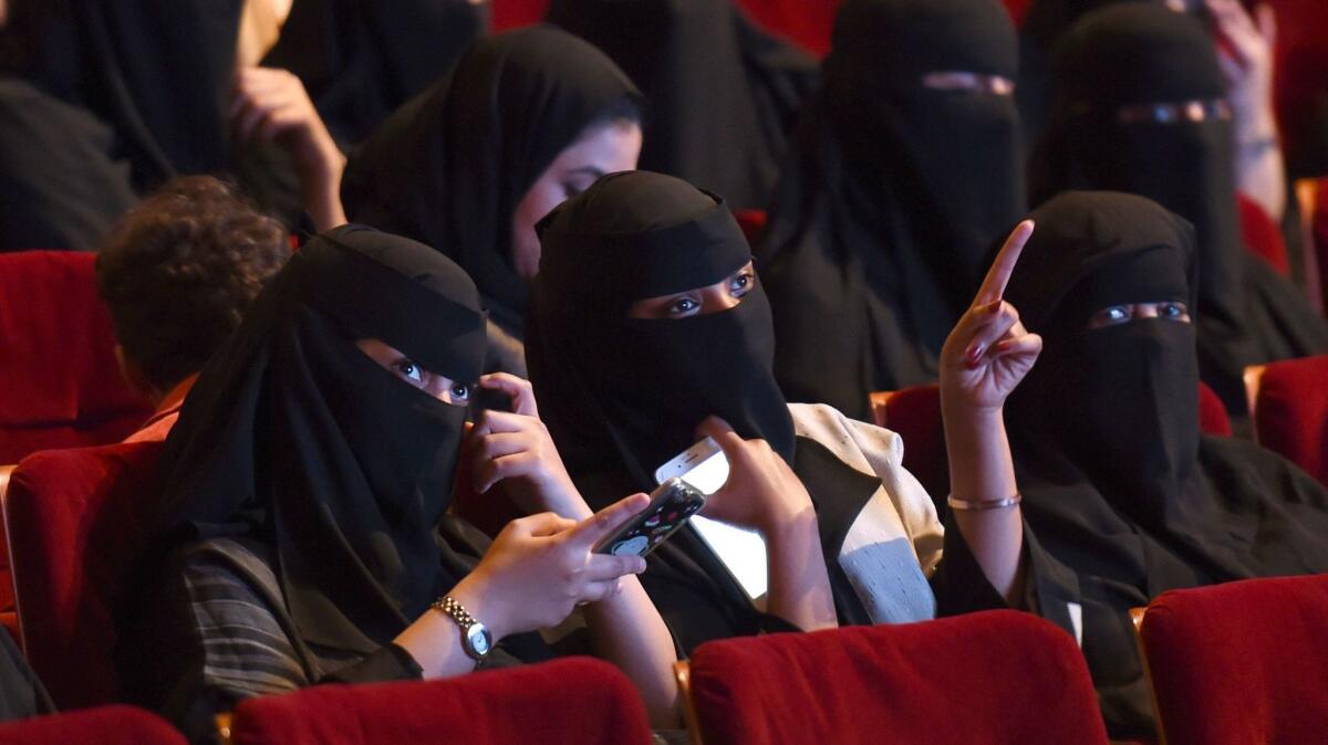 Saudi women attend the "Short Film Competition 2" festival at King Fahad Culture Center in Riyadh on Oct. 20.