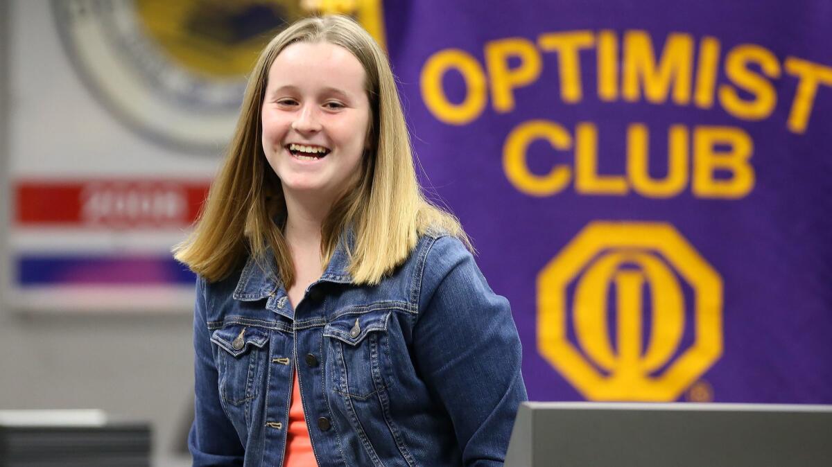 Lyndsay Harris leaves the podium happy about her speech during the Surf City Optimist-Ocean View School District Oratorical Contest on Monday night. Lyndsay placed second in the contest, which addressed the theme "Is there a fine line between optimism and reality?"