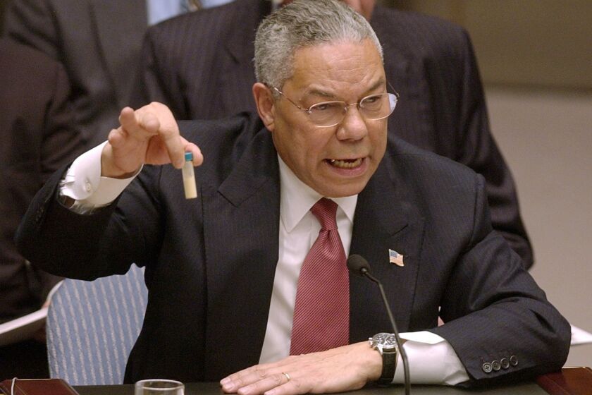 ** FOR USE AS DESIRED, PHOTOS OF THE DECADE ** FILE - Secretary of State Colin Powell holds up a vial he said could contain anthrax as he presents evidence of Iraq's alleged weapons programs to the United Nations Security Council in this Feb. 5, 2003 file photo. (AP Photo/Elise Amendola, File)