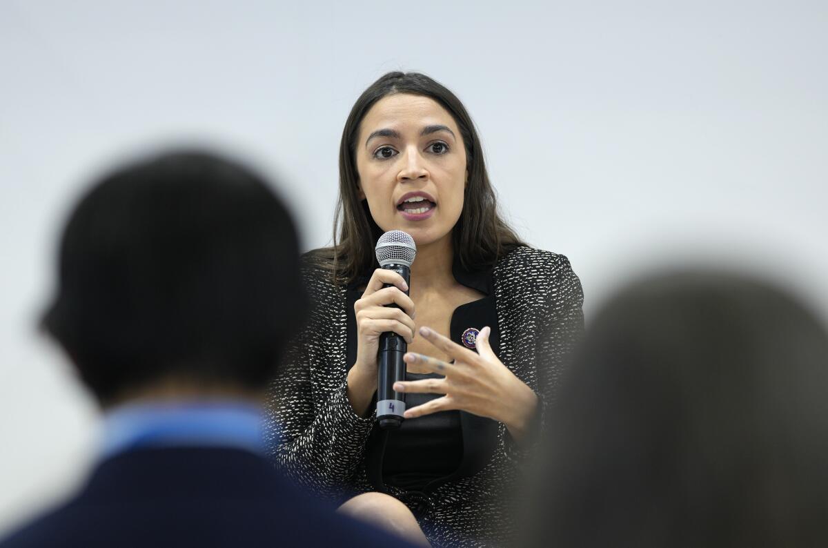 U.S. Rep. Alexandria Ocasio-Cortez speaks at an event at the US Climate Action Center at the COP26 U.N. Climate Summit in Glasgow, Scotland, Tuesday, Nov. 9, 2021. The U.N. climate summit in Glasgow has entered it's second week as leaders from around the world, are gathering in Scotland's biggest city, to lay out their vision for addressing the common challenge of global warming. (AP Photo/Alastair Grant)