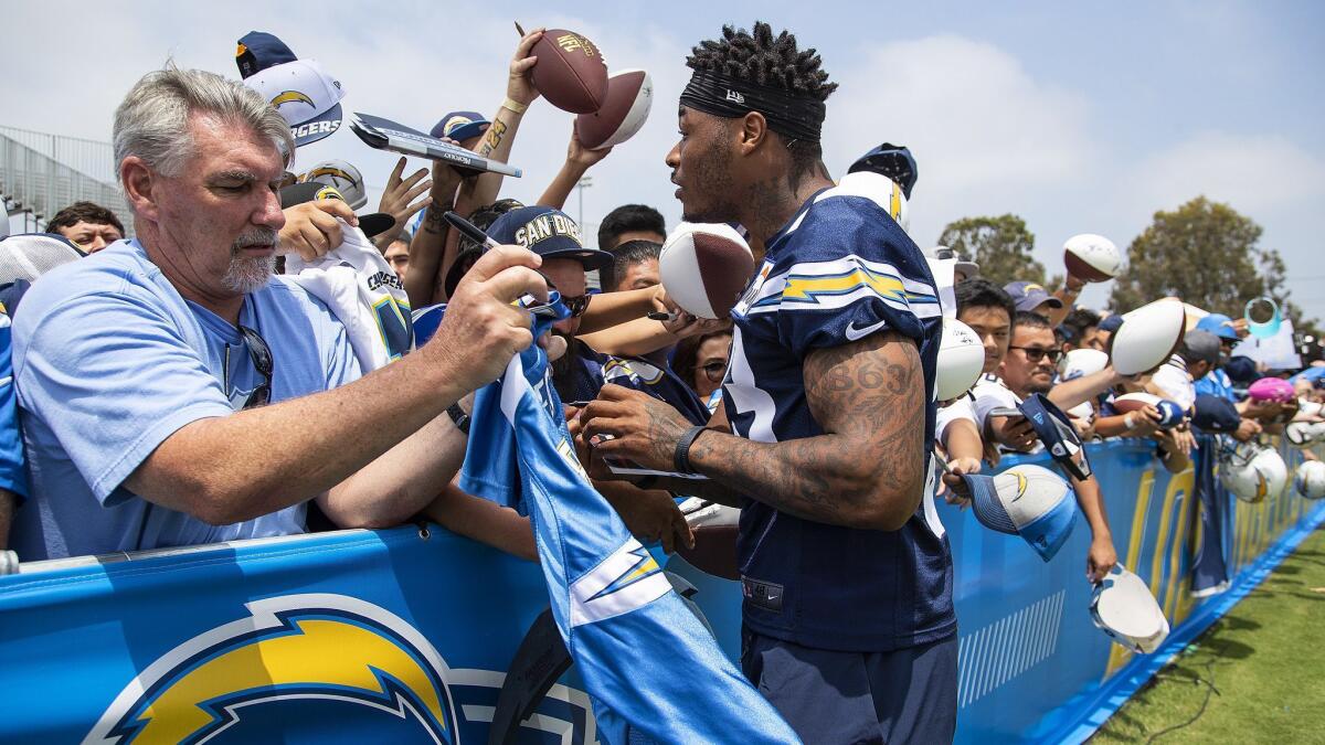 Rookie safety Derwin James meets with Chargers fans after training camp practice in Costa Mesa.