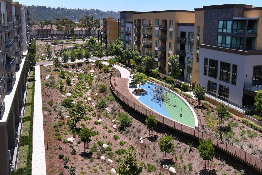 Creekside Park, a linear park with elevated walkways and an off-leash dog run, opens in the Mission Valley's Civita.