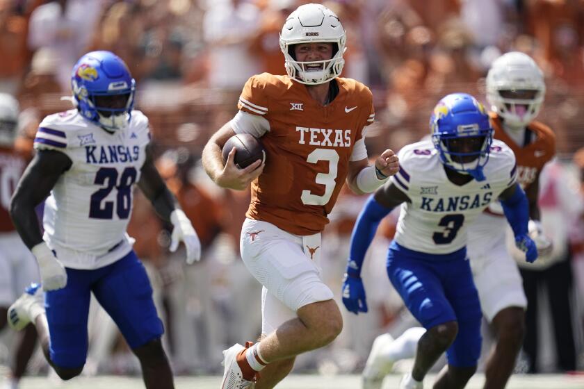 Texas quarterback Quinn Ewers (3) runs for a touchdown against Kansas during the first half of an NCAA college football game in Austin, Texas, Saturday, Sept. 30, 2023. (AP Photo/Eric Gay)