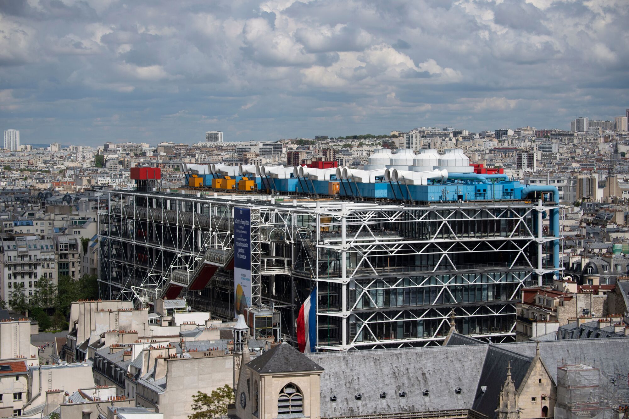 A view of the bright colorful forms of the Centre Georges Pompidou is seen rising above the Paris skyline 