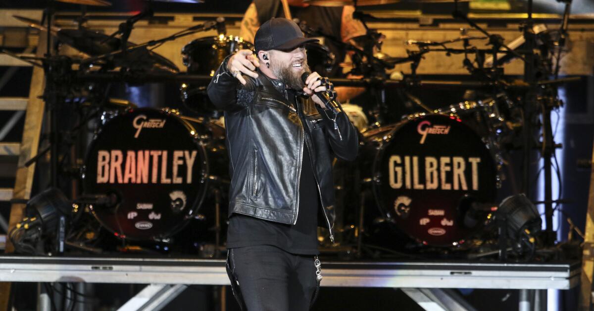 Brantley Gilbert pauses show while wife gives birth on tour bus, then he returns to stage