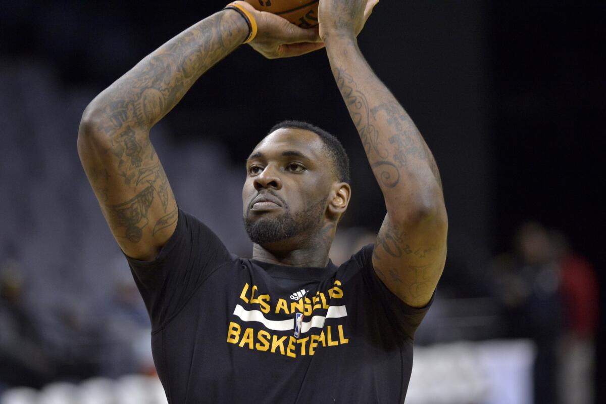 Lakers center Tarik Black warms up before a game on Dec. 3 against the Memphis Grizzlies.
