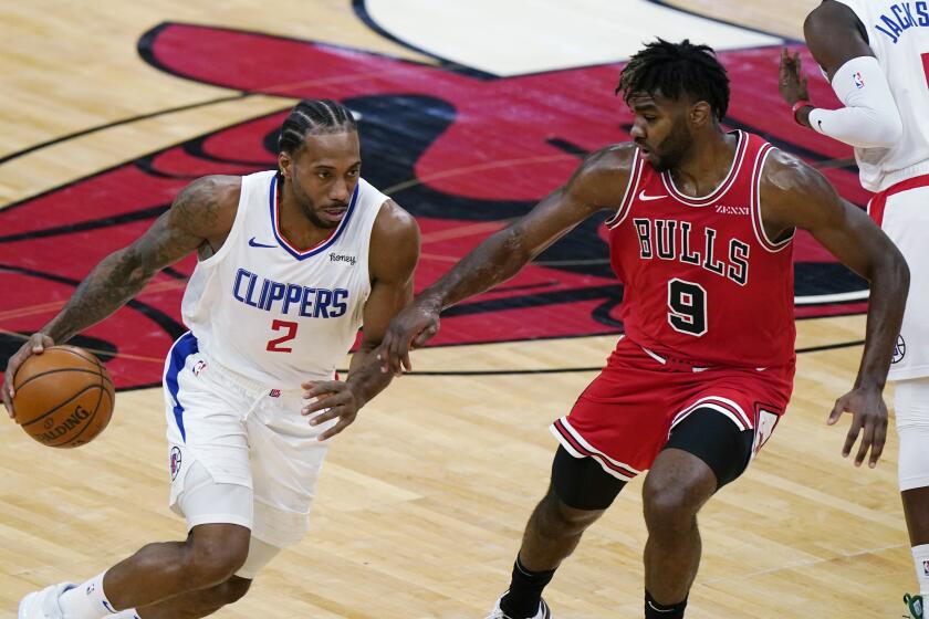 The Clippers' Kawhi Leonard drives against the Chicago Bulls' Patrick Williams during the second half Feb. 12, 2021.