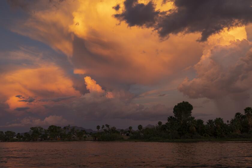 Late monsoon season storm clouds are seen over the Colorado River on October 1, 2022 in Blythe, California. 