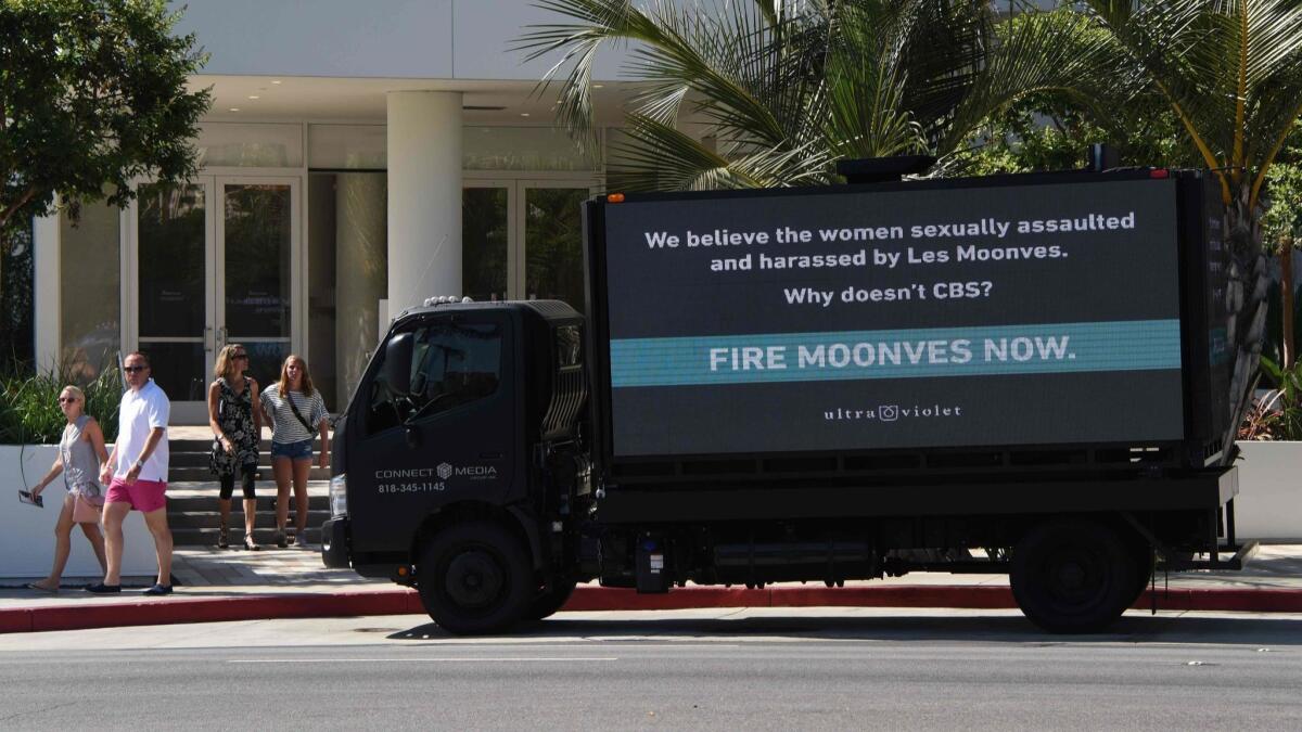 The city of La Cañada Flintridge is considering a ban on mobile billboards. Above, protesters park a billboard truck outside the Beverly Hilton Hotel Aug. 5 with the message urging the CBS Television Network to fire its chief executive, Leslie Moonves,