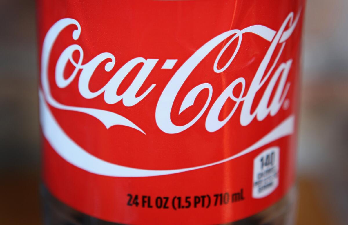 The Coca-Cola logo is printed on the lanel of a 24-ounce bottle of soda in Chicago, Illinois.