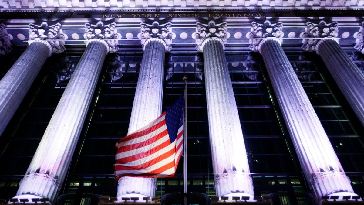 An American flag flies in front of the New York Stock Exchange.