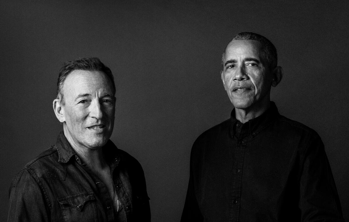 Bruce Springsteen stands next to Barack Obama  