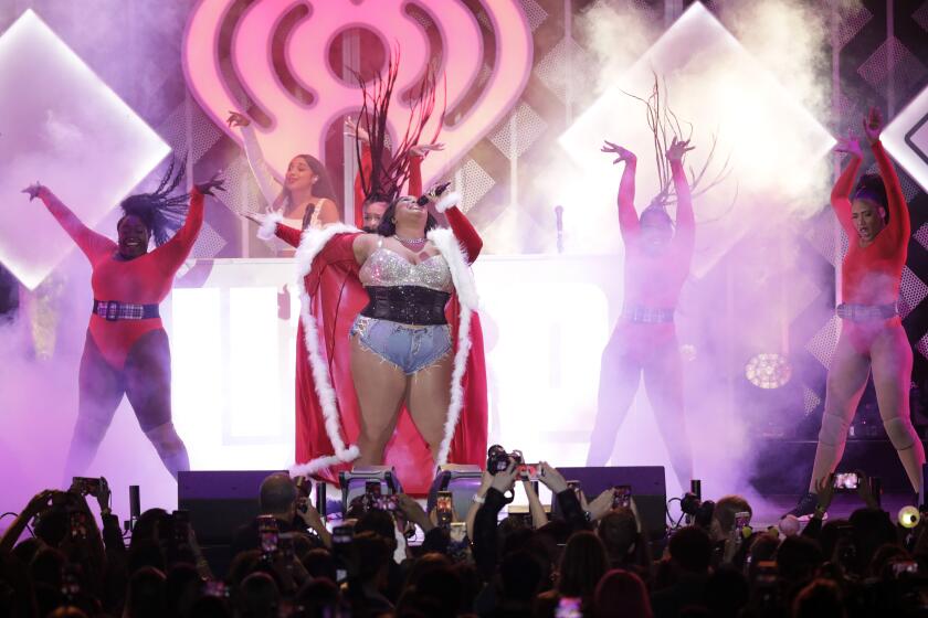 Lizzo performs at KIIS FM’s iHeartRadio Jingle Ball presented by Capital One. (Myung J. Chun / Los Angeles Times)