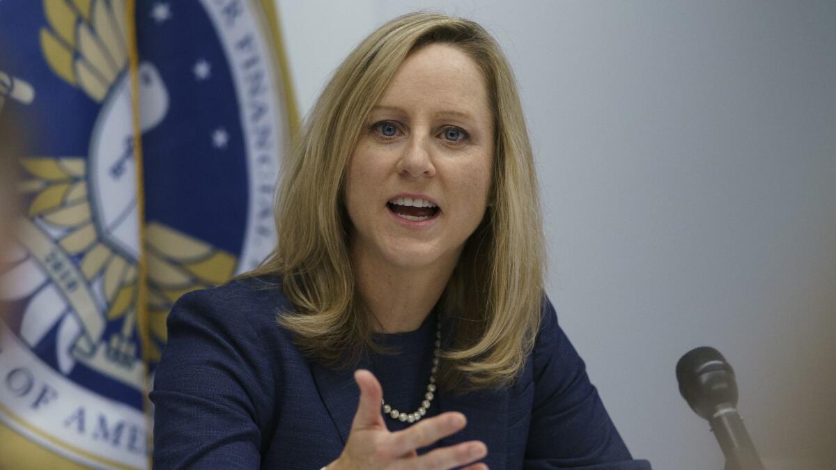 The president should be allowed to fire the Consumer Financial Protection Bureau’s director for any reason, Trump administration lawyers say. Above, Director Kathy Kraninger.