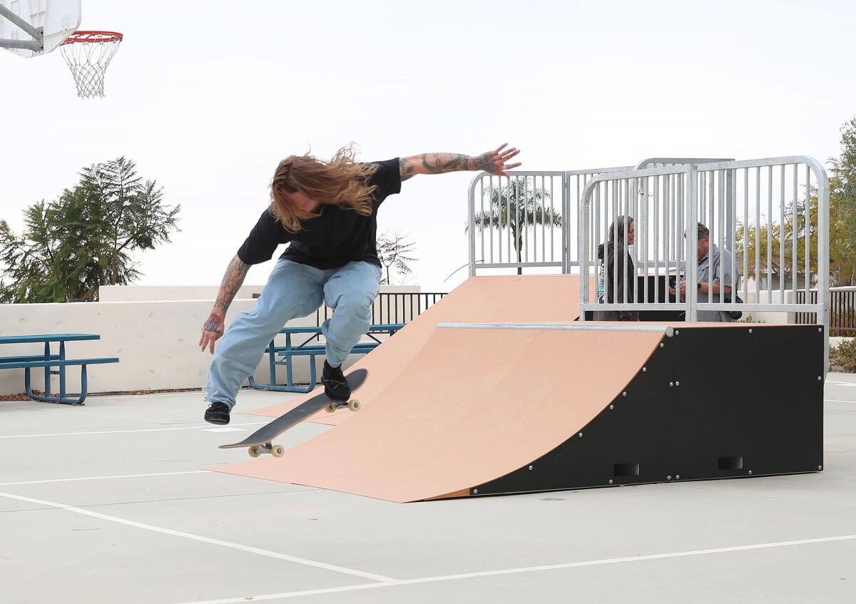 Skateboarder Jake Morel attempts a kick-flip at the Laguna Beach Community and Recreation Center.