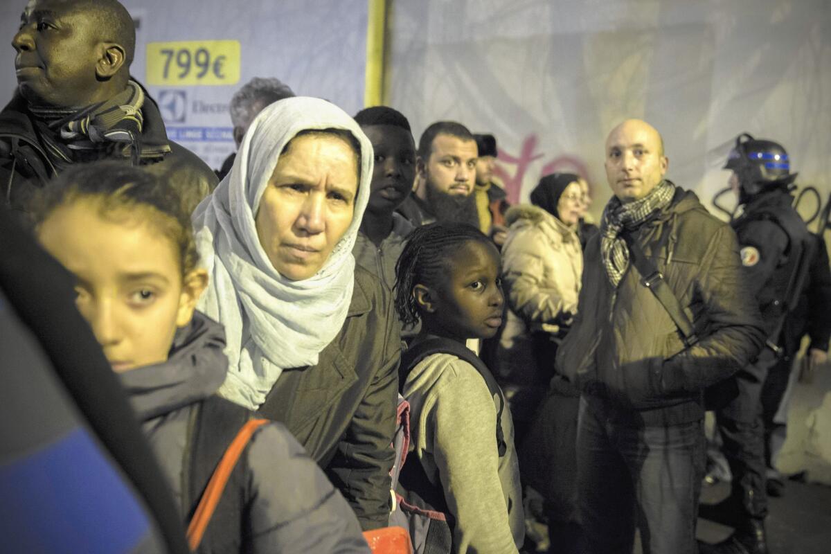 People return home after police give the all-clear in the Porte de Vincennes area of Paris.