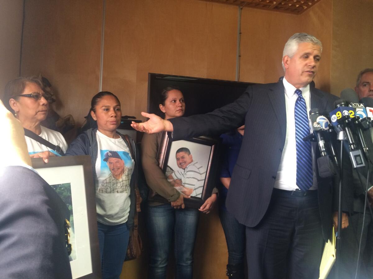 Attorney Arnoldo Casillas addresses reporters about the April 2015 fatal shooting of Luis Martinez, 35, by LAPD officers. Casillas is flanked by the wife and other family members of Martinez.