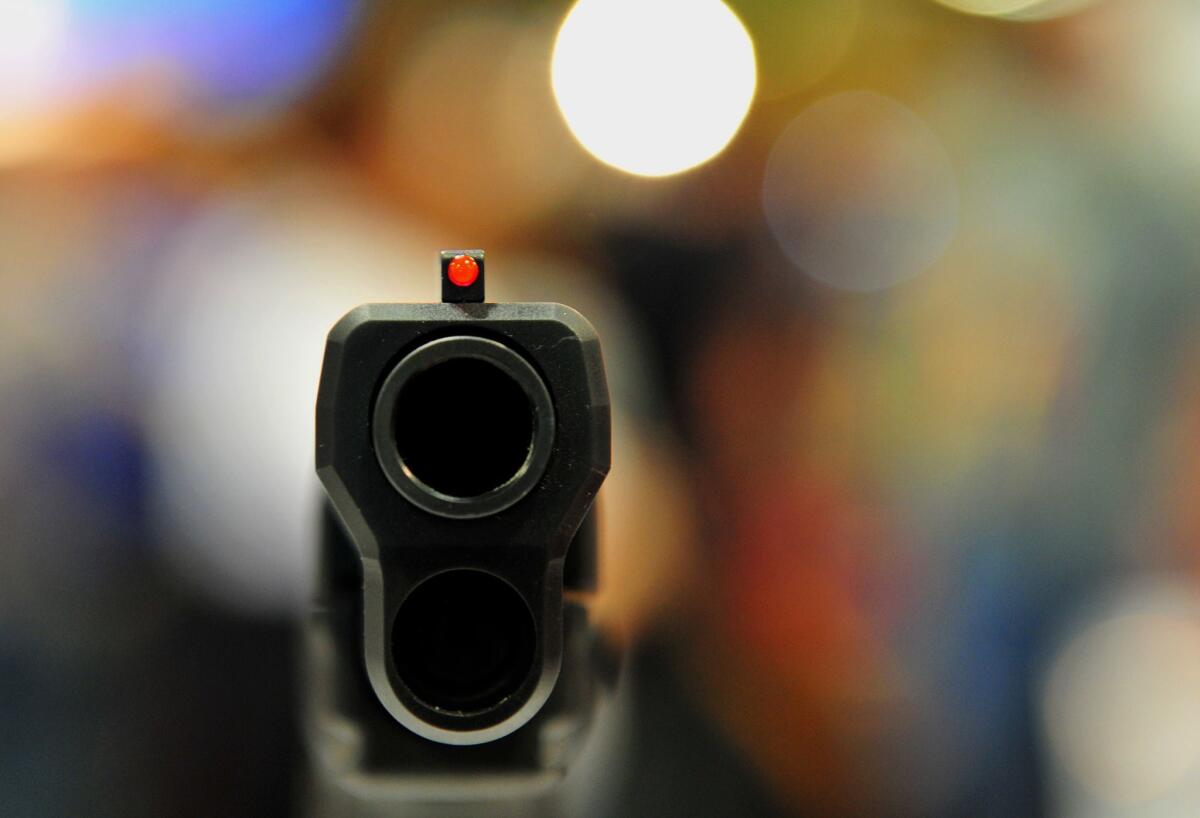 A semiautomatic handgun is displayed at the 2015 NRA convention in Nashville. (Karen Bleier / AFP/Getty Images)