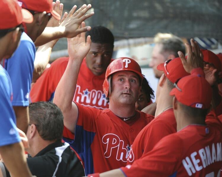 CLEARWATER, FL - FEBRUARY 24: Catcher Brian Schneider #23 of the Philadelphia Phillies celebrates after scoring a run against the Florida State Seminoles February 24, 2011 at Bright House Field in Clearwater, Florida.