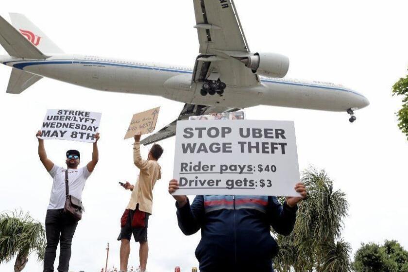 WESTCHESTER, CALIF. -- WEDNESDAY, MAY 8, 2019: Rideshare Drivers United picket near Los Angeles International airport demanding higher wages in Westchester, Calif., on May 8, 2019. (Gary Coronado / Los Angeles Times)