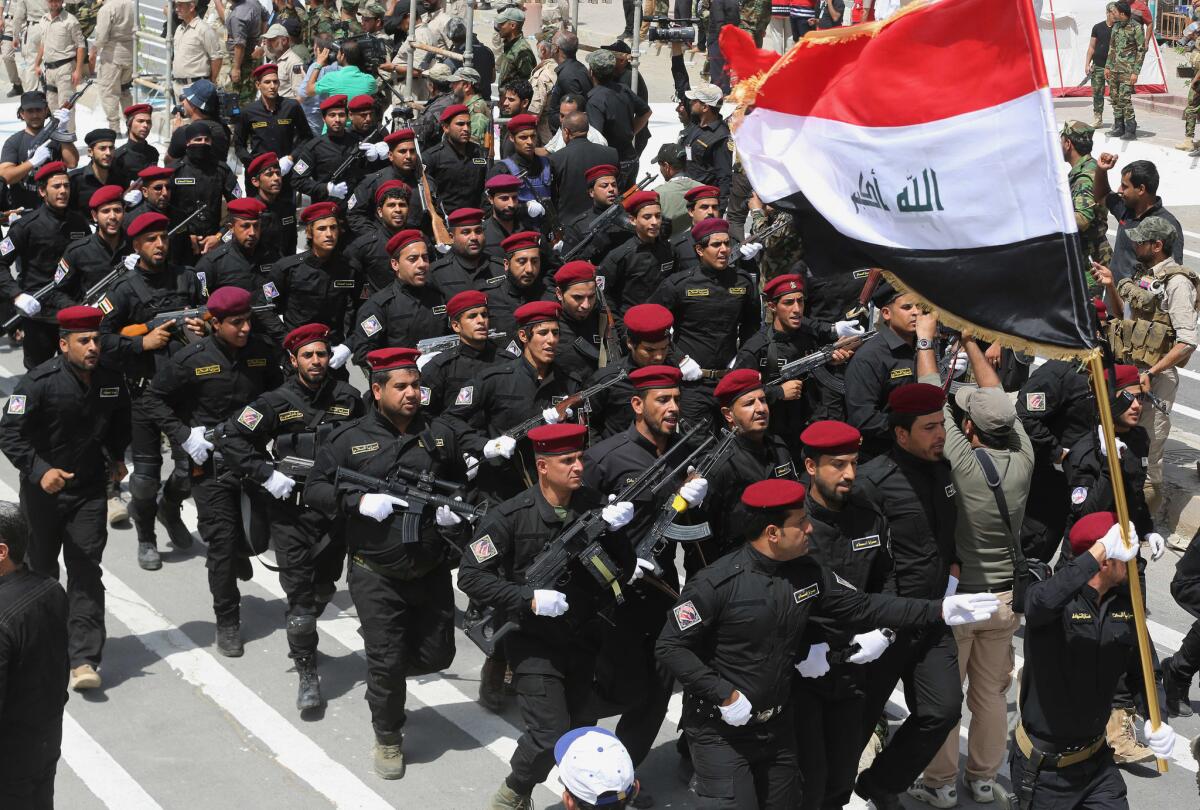 Volunteers called to arms by Muqtada Sadr march in the streets of the Shiite stronghold of Sadr City in Baghdad.