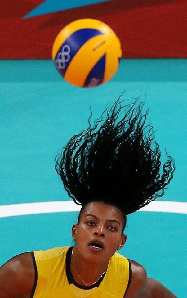Fernanda Rodrigues of Brazil has a hair-raising experience while playing women's volleyball against Japan on Thursday.