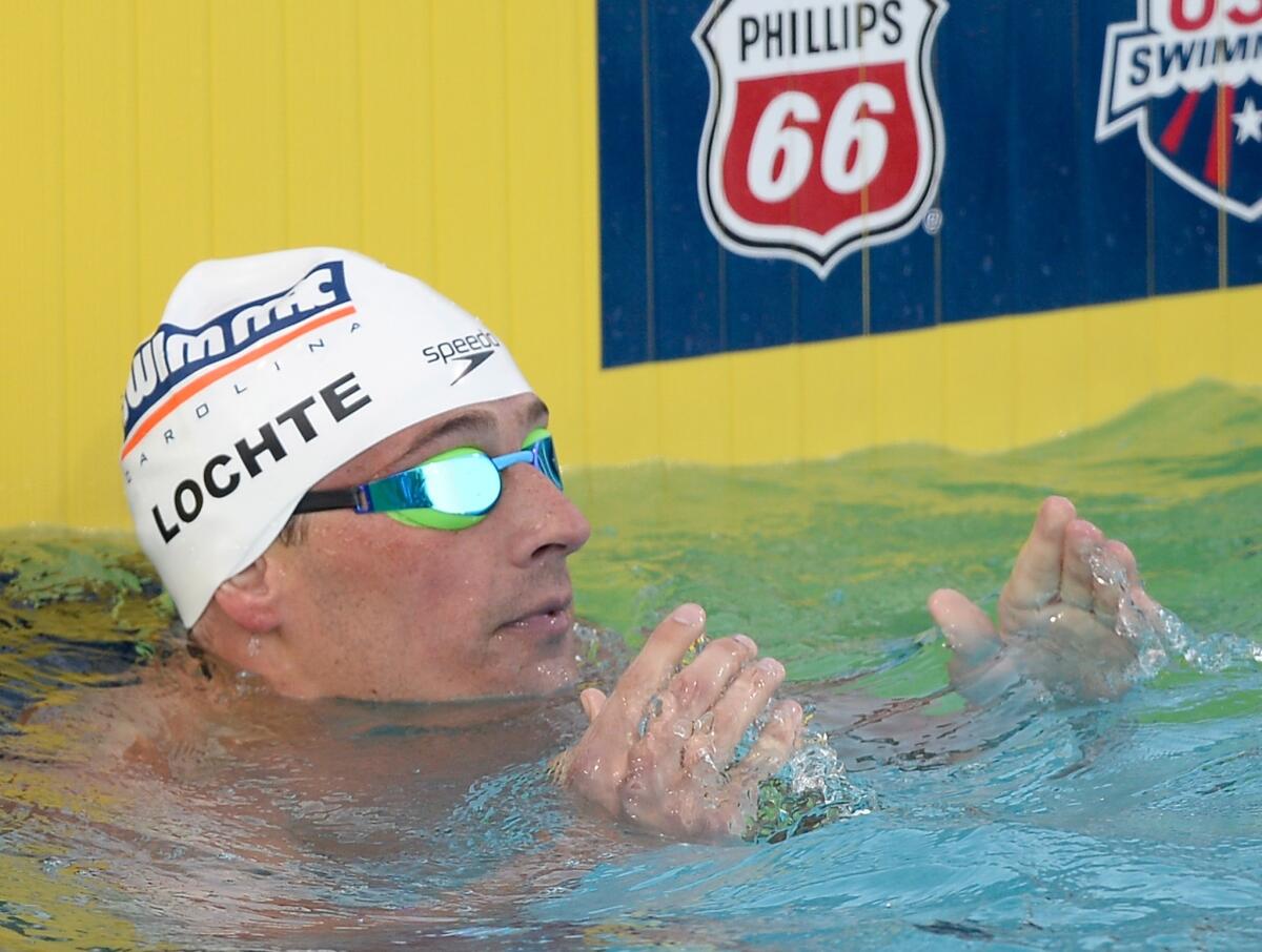 Ryan Lochte reacts after his first place finish in the 200 meter final at the National Championships in Irvine at the Woollett Aquatic Center.