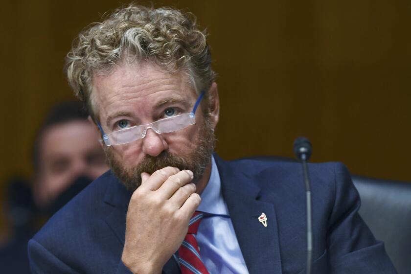 Sen. Rand Paul, R-Ky., listens to testimony before the Senate Committee for Health, Education, Labor, and Pensions hearing, Tuesday, May 12, 2020 on Capitol Hill in Washington. Dr. Anthony Fauci, director of the National Institute of Allergy and Infectious Diseases, is to testify before the committee. (Toni L. Sandys/The Washington Post via AP, Pool)