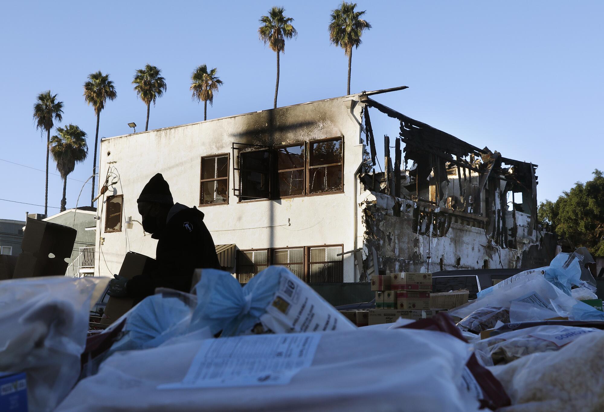 The charred exterior of Victory Baptist Church, in the background. 