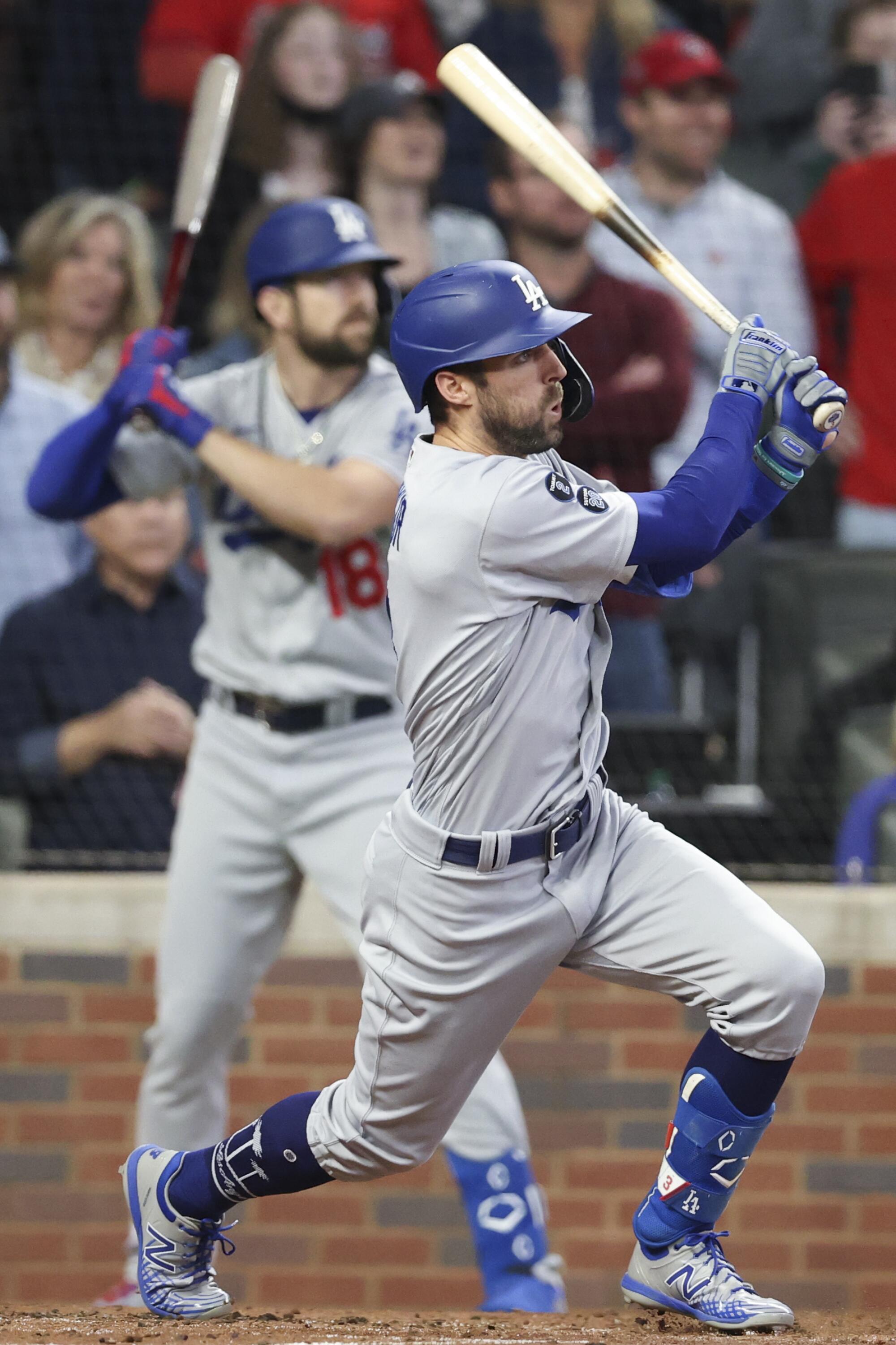 Los Angeles Dodgers' Chris Taylor follows through on a swing for an RBI single to drive in AJ Pollock