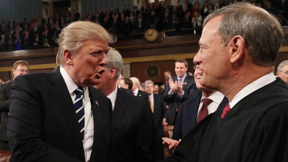 President Trump shakes hands with Chief Justice John G. Roberts Jr. before his State of the Union address on Feb. 28, 2017.