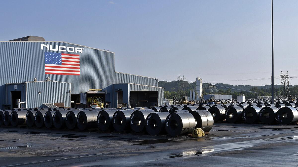 Rolls of steel await shipment at the NUCOR Steel Gallatin plant in Ghent, Ky., in July.