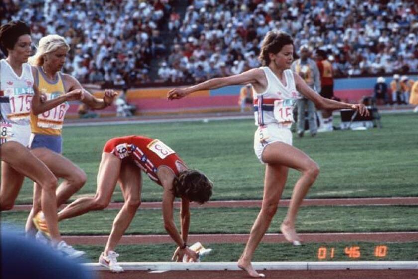 Mary Decker gets tangled up with Zola Budd and falls in the women's 3,000 meters.