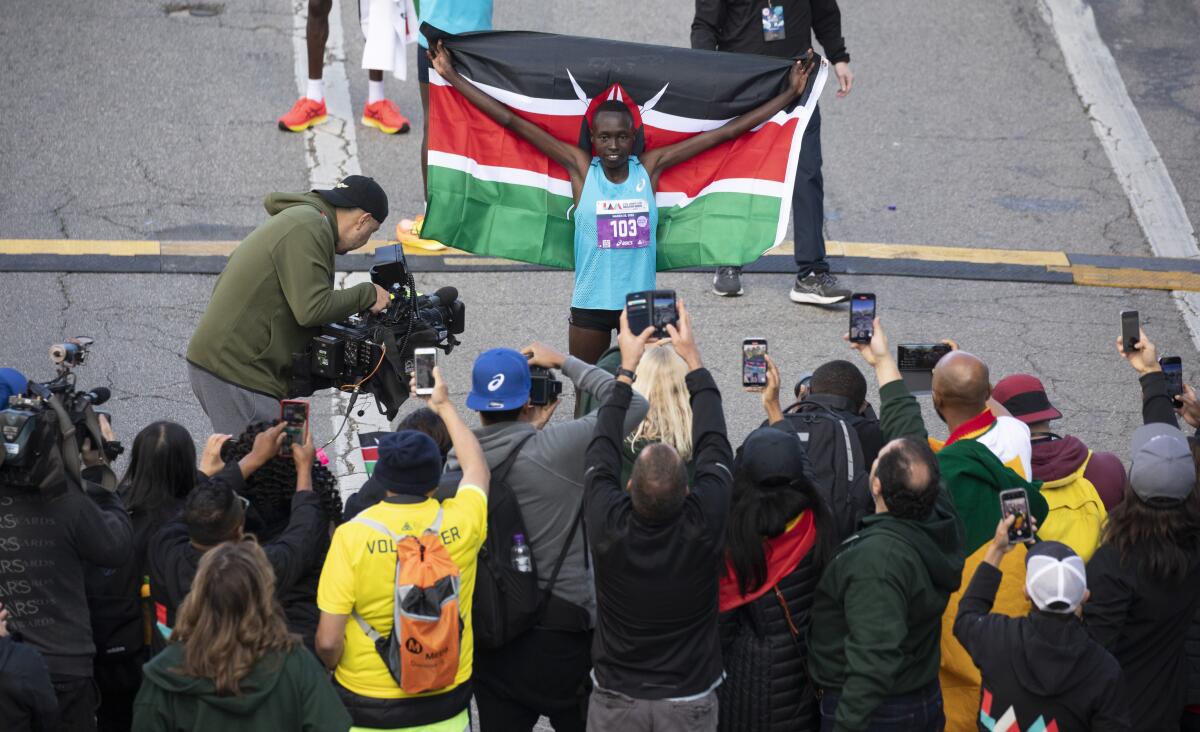 A runner holds up a flag