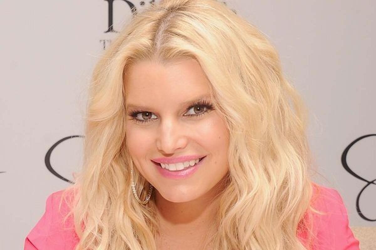 Jessica Simpson confirms her second pregnancy on Christmas Day, via Twitter.