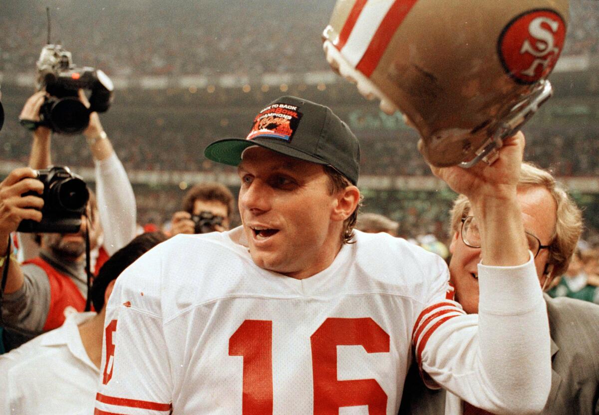 49ers quarterback Joe Montana celebrates after winning his fourth Super Bowl on Jan. 28, 1990.  