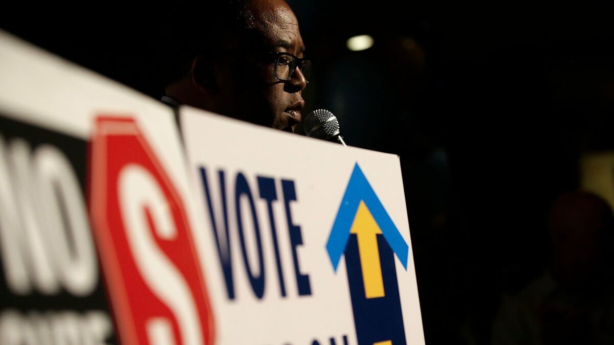 L.A. County Supervisor Mark Ridley-Thomas offers words of encouragement to supporters of Measure H as they wait for returns on election night.