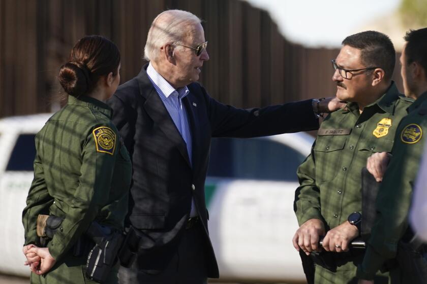 President Joe Biden talks with U.S. Border Patrol agents as they stand along a stretch of the U.S.-Mexico border in El Paso Texas, Sunday, Jan. 8, 2023. (AP Photo/Andrew Harnik)