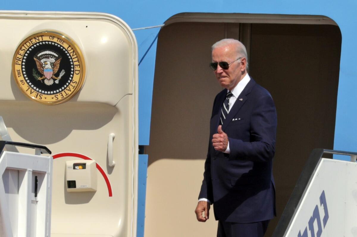 President Biden gestures before his departure to Saudi Arabia from Ben Gurion Airport near Tel Aviv, Israel, on July 15.