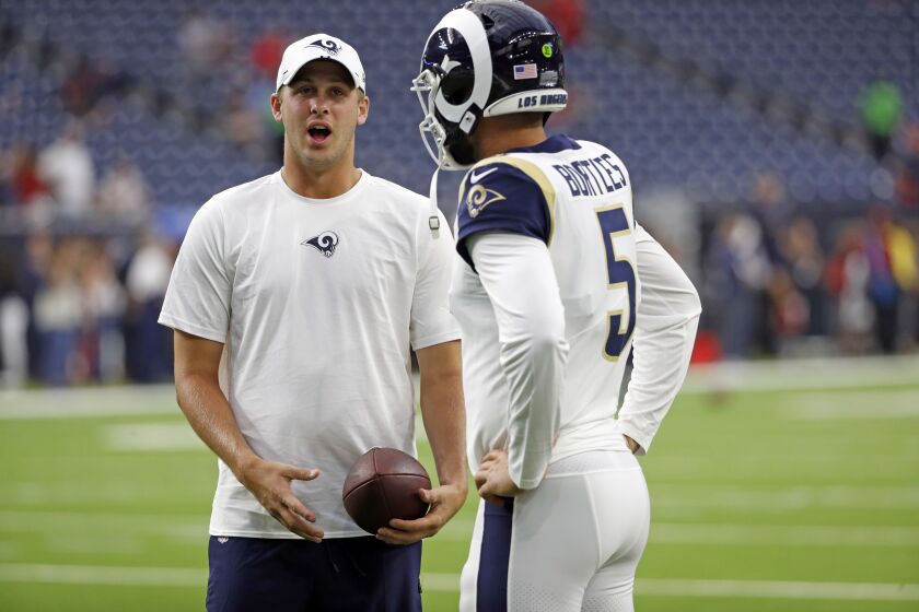 Los Angeles Rams quarterback Jared Goff, left, talks with quarterback Blake Bortles (5) before a preseason NFL football game against the Houston Texans Thursday, Aug. 29, 2019, in Houston. (AP Photo/Kevin M. Cox)