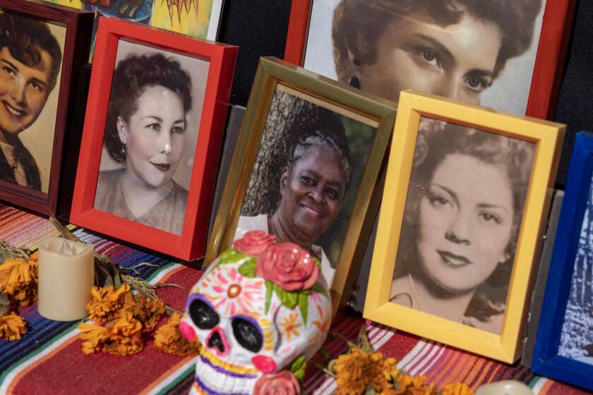 Los Angeles, CA - October 28: An offend honoring mothers at Gloria Molina Grand Park's 12th annual Downtown Dia de los Muertos, where parkgoers gathered to pay reverence at 19 altars created by professional artists and local community organizations on Saturday, Oct. 28, 2023 in Los Angeles, CA. (Brian van der Brug / Los Angeles Times)