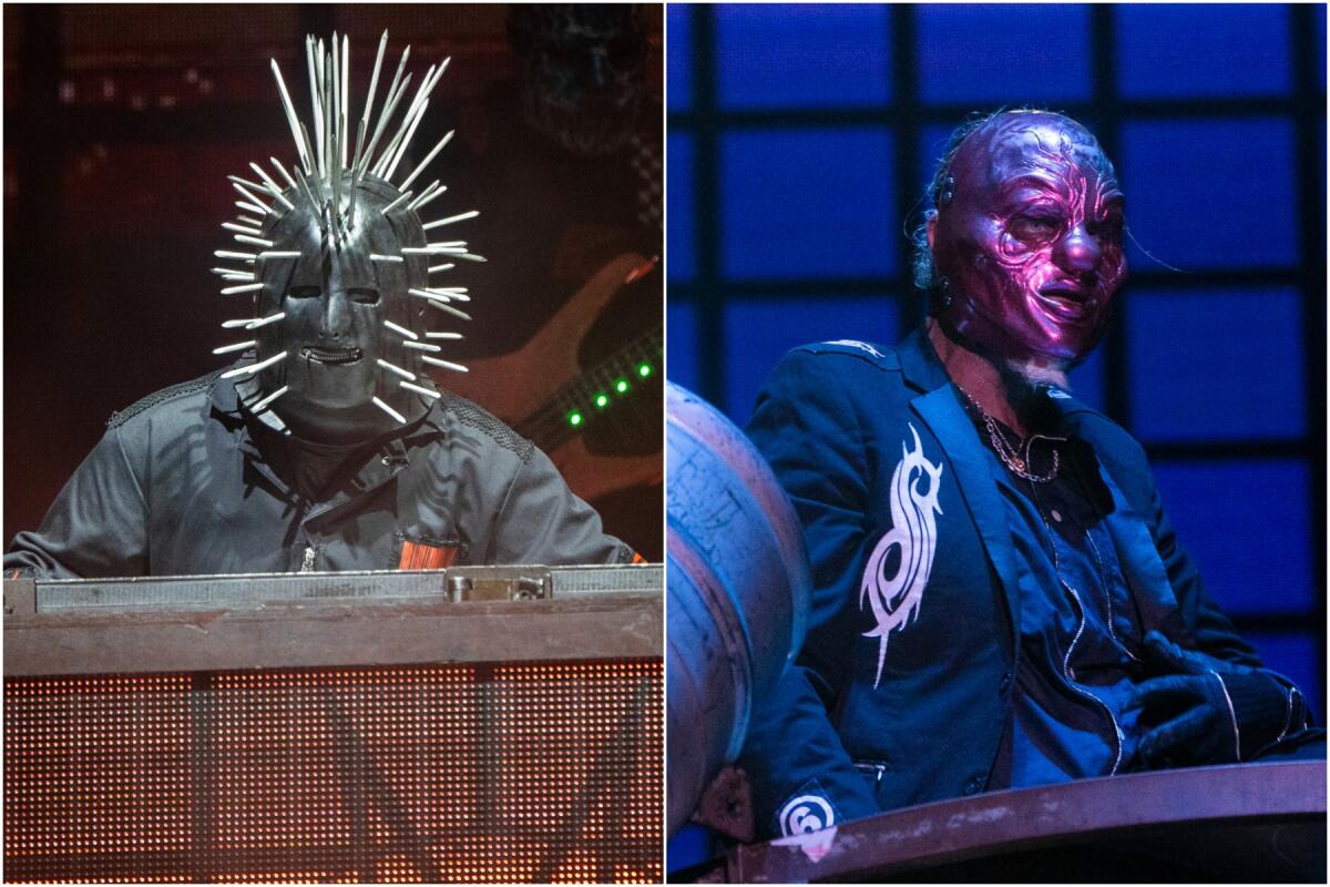 A man in a mask with spikes performs onstage, left. A man in a clown mask, right, plays percussion instruments. 