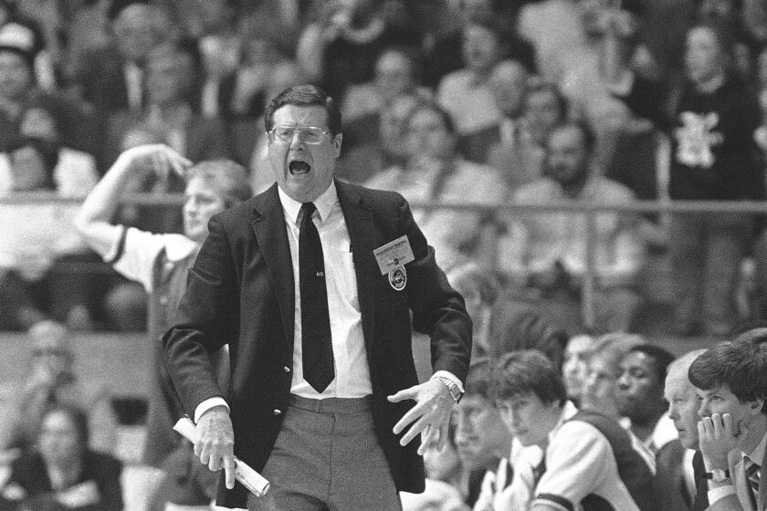 Kentucky basketball coach is shown yelling on the sidelines in an undated photo. (AP Photo)