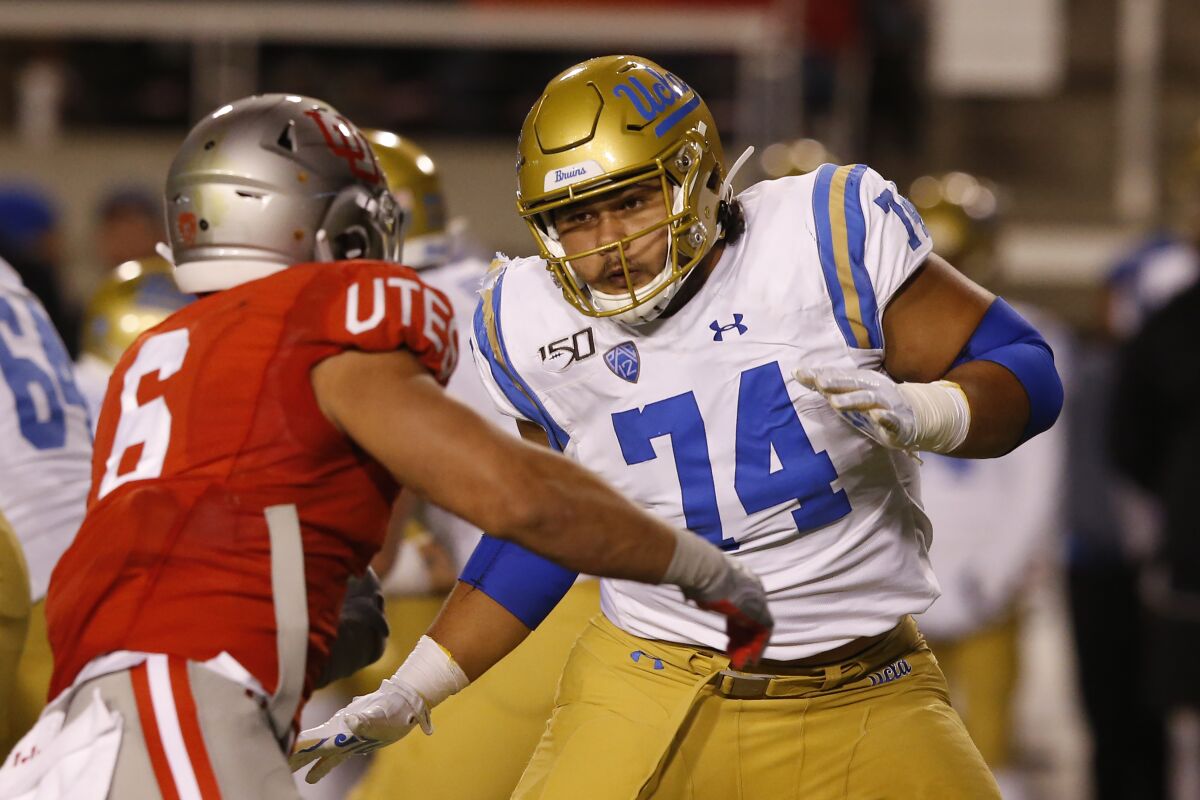 UCLA offensive lineman Sean Rhyan (74) blocks Utah defensive end Bradlee Anae (6)