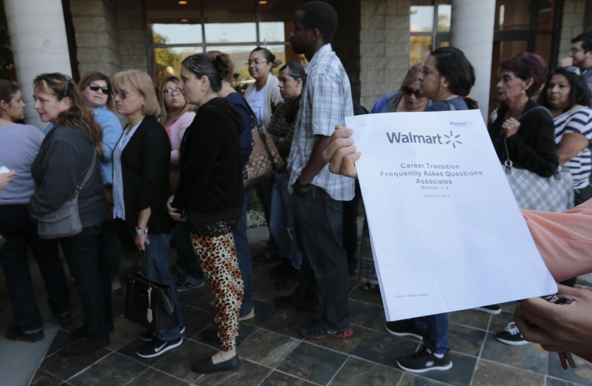Workers at Wal-Mart's closed Pico Rivera store lined up last Thursday to hear their fate.