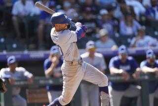 Dodgers' Mookie Betts hits a single against the Colorado Rockies on Sept. 26, 2023, in Denver. 