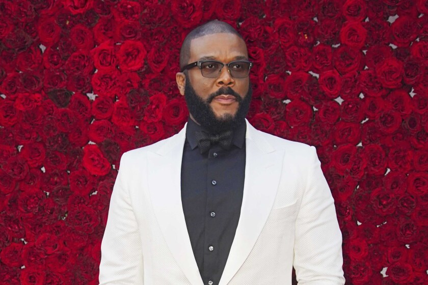FILE - Tyler Perry poses at the grand opening of Tyler Perry Studios in Atlanta on Oct. 5, 2019. Perry and the Motion Picture and Television Fund are being honored with the Jean Hersholt Humanitarian Award, the Academy of Motion Picture Arts and Sciences said Thursday. Perry and the MPTF will receive their Oscar statuettes at the 93rd Academy Awards on April 25. (Photo by Elijah Nouvelage/Invision/AP, File)