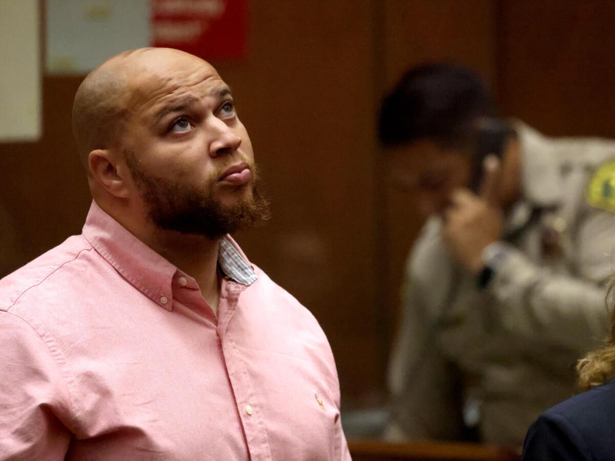 Indicted L.A. County probation Officer Lenton Abram listens to Judge Ronald Coen before pleading no contest.